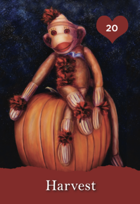 Sock monkey sitting on a pumpkin