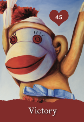 Sock monkey with arms in the air